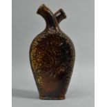 A Treacle Glazed Ceramic Double Gimmel Flask, Moulded Floral Design, 18cm high