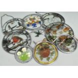 A Collection of Nine Circular Coloured Glass Wall Hangings