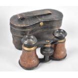 A Vintage Cased Pair of Leather Mounted Opera Glasses