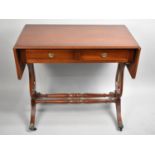 A Modern Crossbanded Drop Leaf Two Drawer Table on Lyre Supports with Turned Stretchers, 88cms Wide