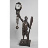 A Novelty Bronze Figural Mystery Clock in the Form of a WWI Period Pilot holding Aircraft