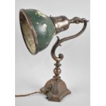 An Edwardian Adjustable Desk Top Reading Lamp with Scrolled Support, 35cms High