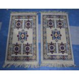 A Pair of Machine Woven Hearth Rugs, Each 76x43cm