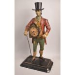 A Vintage Novelty Cast Iron Figure Clock Seller by JVE, 40cms High