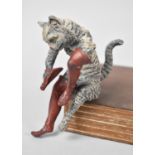 A Cold Painted Bronze Study of Seated Puss in Boots, Cleaning boot, 8cms High