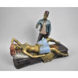 A Reproduction Bronze Novelty Risque Figure Group in the Bergmann Style Depicting Magician