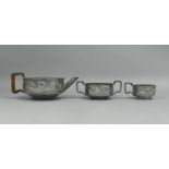A Pewter Three Piece Tea Service by Tamco with Organic Art Nouveau Floral Decoration in relief,
