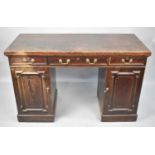 An Edwardian Mahogany Kneehole Desk with Crossbanded Top and Banded Inlay, Three Drawers and Two