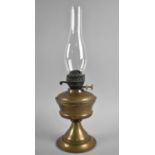 An Early 20th Century Brass Oil Lamp, with Glass Chimney