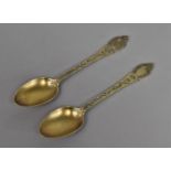 A Pair of Victorian Silver Gilt Teaspoons with Ornate Chased Decoration by Elkington & Co.