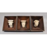 A Set of Three Wooden Framed Polish Studies of Cleric's Masks in Stoneware, The Frame having Paper