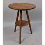 An Edwardian Circular Topped Tripod Table With Stretcher Shelf, 45cms Diameter and 60ms High