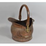 A Vintage Copper Helmet Shelped Coal Scuttle, 43cm high
