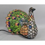 A Reproduction Tiffany Style Novelty Table Lamp in the Form of a Peacock, 28cms High