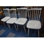 A Set of Four White Painted Spindle Back Back Dining Chairs