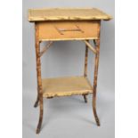 An Edwardian Bamboo Sewing Box Table with hinged Lid, Stretcher Shelf, 47cms Wide