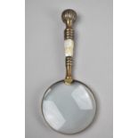A Brass and Mother of Pearl Handled Desktop Magnifying Glass, 26cms Long