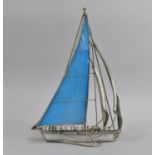 A Modern Silver Plated and Resin Model of a Sailing Yacht, 26.5cms High