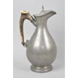 A Pewter Lidded Jug with Antler Handle by James Dixon and Sons, Sheffield, 26cms High