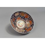 A Japanese Porcelain Imari Bowl, Floral Motif Decoration and Central Phoenix Cartouche, Blue