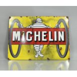 A Distressed Reproduction Enamelled Sign for Michelin Tyres in Yellow, Red and White. 61cms by 44cms