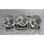 A Set of Eight 19th Century Japanese Porcelain Plates decorated in Under Glazed Blue Blossoming