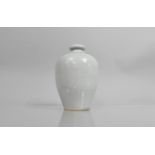 A Chinese Celadon Vase of Baluster Form having Short Bottle Neck, Incised Design, 19cms High