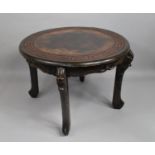 a 19th Century Chinese Table with a Circular Top over Pierced Rails and Cabriole Legs, The Carved