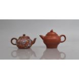 Two Chinese Yixing Miniature Teapots, to include Applied Famille Rose Enamel Decorated Example