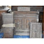 A Collection of Early Carved Oak Panels and Cabinet Parts together with a Door