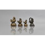 A Graduated Set of Three Oriental Bronze Opium Weights together with a Further Single Example with