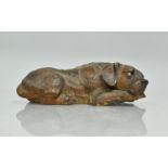 A Black Forest Carved Wooden Study of Recumbent Hound, 23cms Long