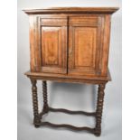 An Early Oak Cabinet on Unrelated Stand having Panelled Doors to Shelved Interior, Bobbin