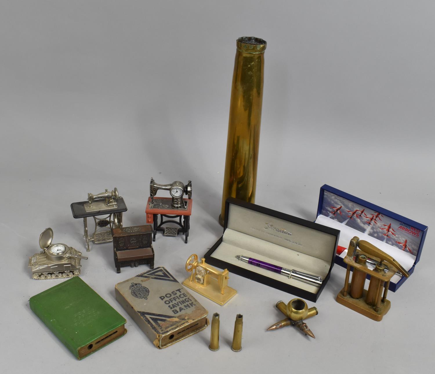 A Collection of Metal Items to Include Brass Trench Art, Brass Shell Base, Miniature Treadle