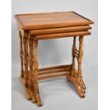 A Late 20th Century Yew Wood Nest of Three Tables, 51cm wide