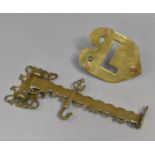 A Victorian Brass Range Crane and a Heart Shaped Trivet Monogrammed L