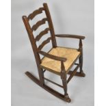 A Mid 20th Century Child's Back Ladder Back Rocking Chair