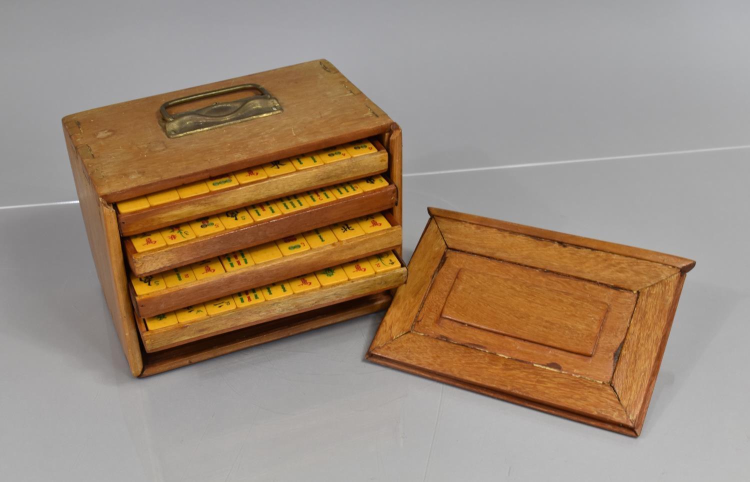 A Mid/Late 20th Century Mah Jong Set Housed in Wooden Chest with Brass Top Handle, Slide Front Panel