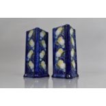 A Pair of Square Form Vases decorated with Floral Tube line Design on Blue Ground, 21cms High,