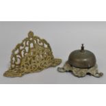 A Pierced Brass Desk Top Letter Rack and a Counter Bell