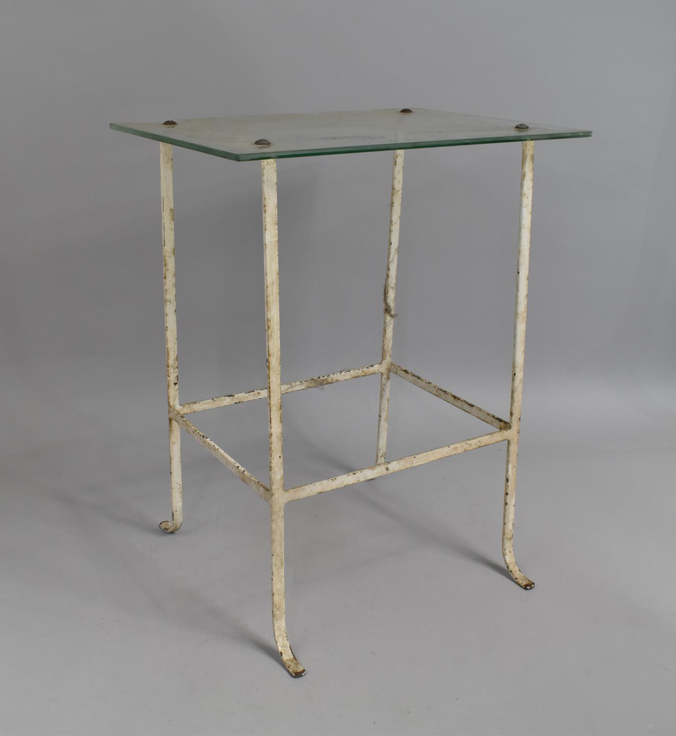 A Glass Top Iron Based Table, 51cm high