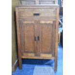 An Edwardian Oak Side Cabinet with Top Drawer and Panelled Cupboard Doors, 55cm wide