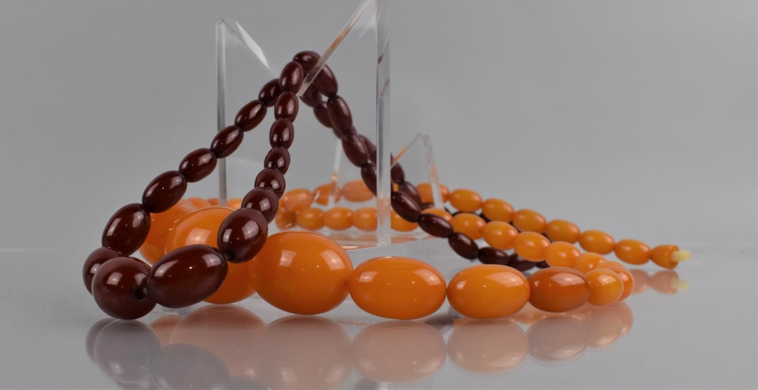 Two Strings of Early to Mid 20th Century Bakelite Amber Beads, Cherry and Egg Yolk, Both Approx