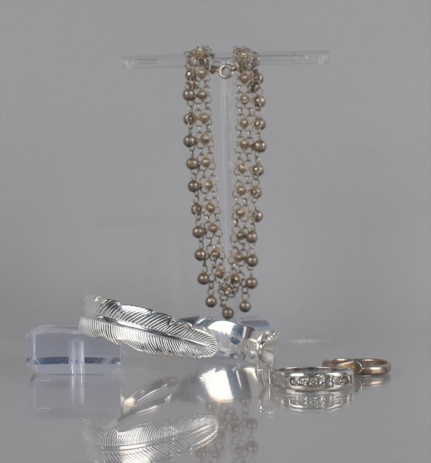 A Collection of Silver and White Metal Items to include Feather Cuff, Stamped S999, A Silver and