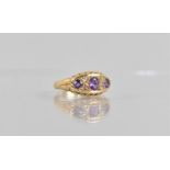 An 18ct Gold, Amethyst and Diamond Boat Ring, Central Oval Cut Amethyst 5mm by 3.5mm, Two Smaller