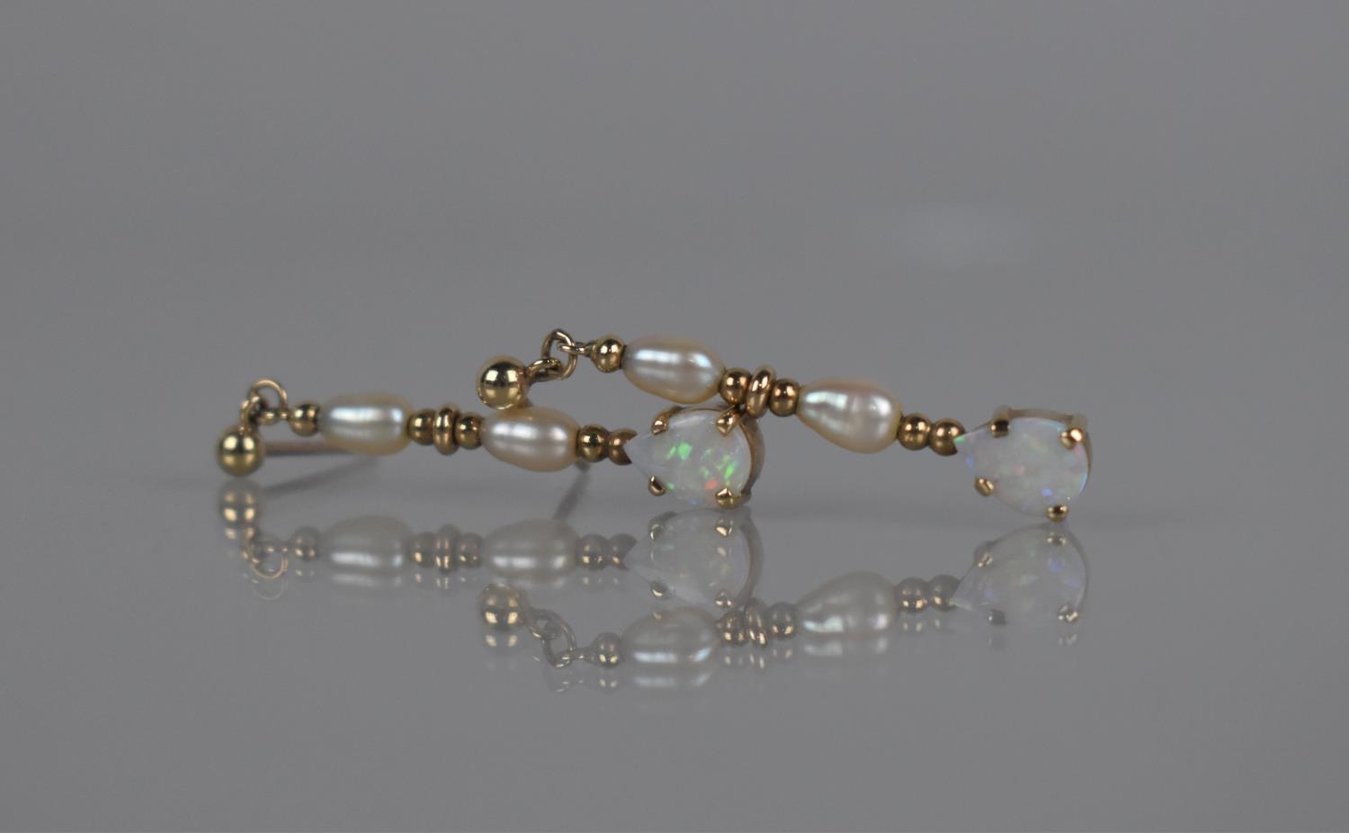 A Pair of 9ct Gold, Opal and Pearl Drop Earrings, Teardrop Opal Cabochon 7mm by 5mm Surmounted by - Image 2 of 2