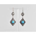A Pair of Egyptian Silver and Turquoise Earrings, Central Raw Polished Stone approx 7mm by 8mm, (
