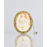 A Large Victorian Shell Cameo Brooch depicting Classical Maiden, Possibly Virgo, Seated on Rocks and