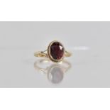 A Victorian Style 9ct Gold and Garnet Ladies Dress Ring, Central Oval Cut Garnet 9mm by 7mm, Bezel