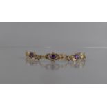 A 9ct Gold and Amethyst Bracelet Comprising Three Oval Cut Stones Measuring 5.5mm by 7mm, Four